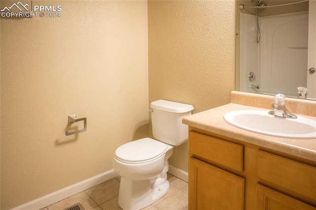 bathroom with walk in shower, tile patterned flooring, vanity, and toilet