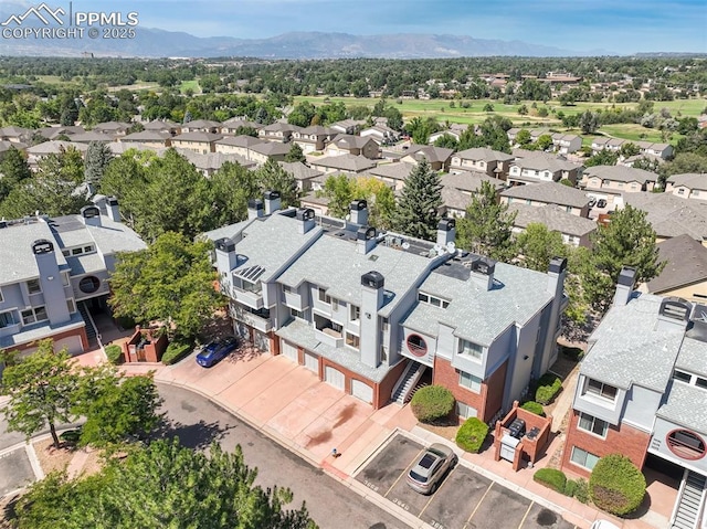 birds eye view of property with a mountain view