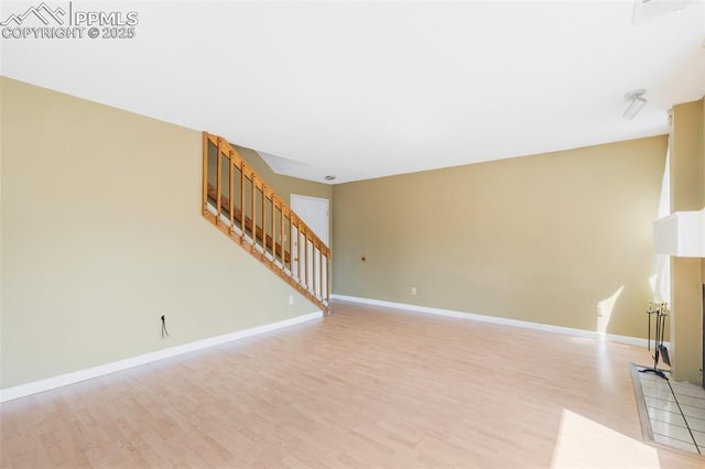 unfurnished living room featuring light hardwood / wood-style flooring