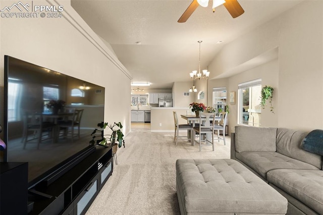 living room with ceiling fan with notable chandelier, lofted ceiling, and light carpet