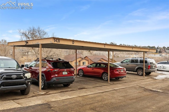 view of parking / parking lot with a carport