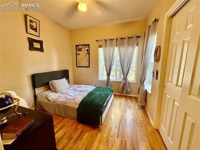 bedroom featuring ceiling fan and light hardwood / wood-style flooring