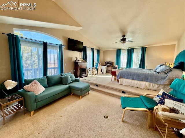 bedroom with carpet flooring, multiple windows, ceiling fan, and vaulted ceiling