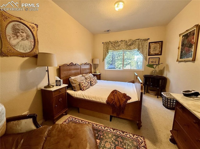 carpeted bedroom featuring a textured ceiling and vaulted ceiling