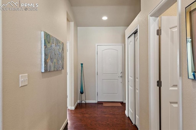 hallway with dark wood-type flooring