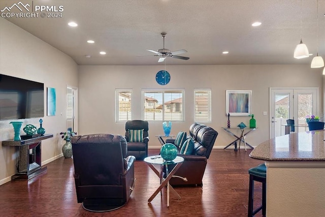 living room with dark hardwood / wood-style floors and ceiling fan