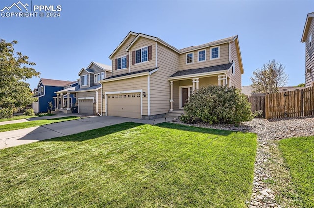 front facade featuring a garage and a front lawn