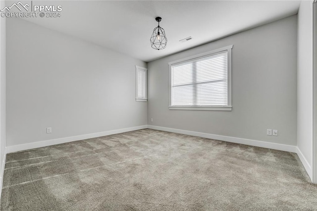 view of carpeted spare room