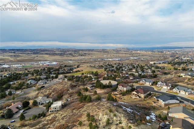 birds eye view of property featuring a mountain view