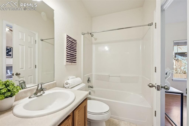 full bathroom with vanity, shower / bathtub combination, and toilet