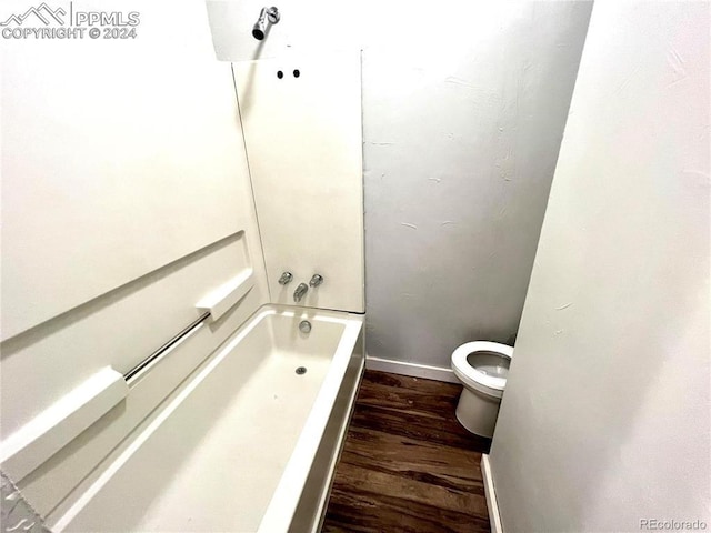 bathroom featuring wood-type flooring and toilet