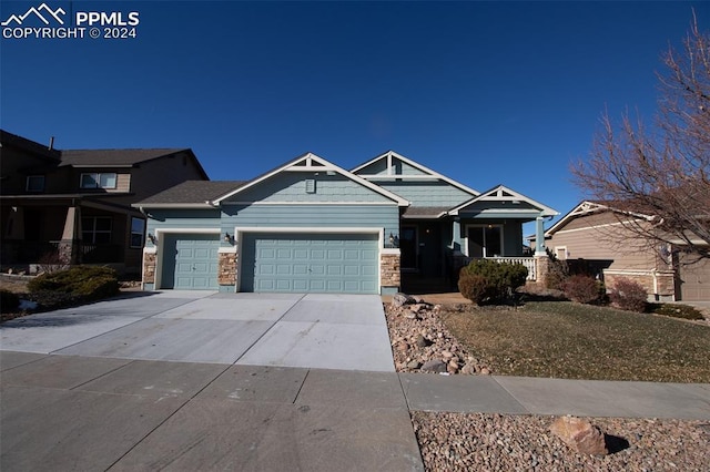 craftsman-style home with a garage