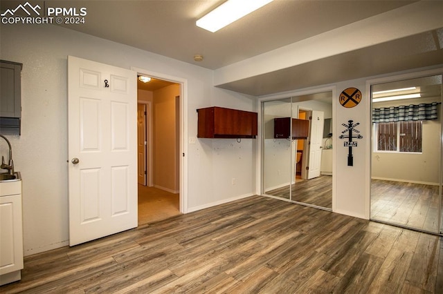 spare room featuring dark hardwood / wood-style flooring