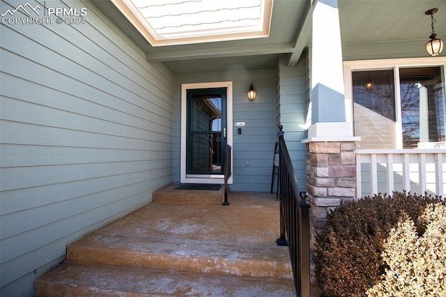 doorway to property with a porch