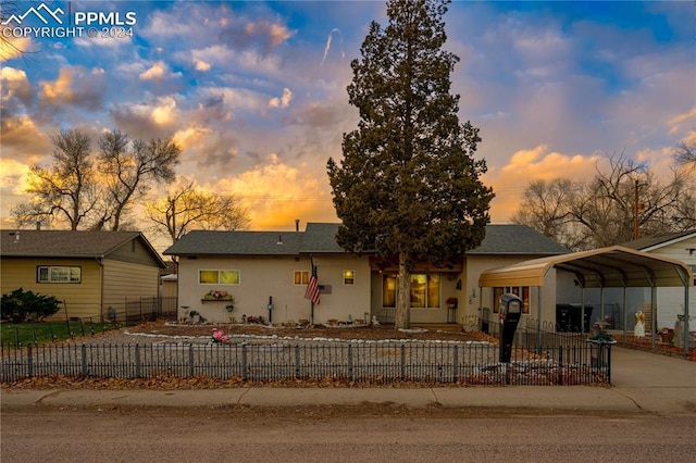 view of front of home featuring a carport