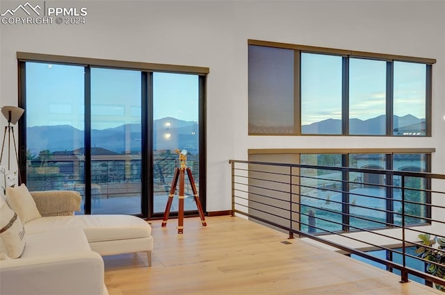 living room with hardwood / wood-style flooring and a mountain view