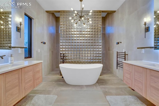 bathroom featuring vanity, tile walls, plus walk in shower, and a chandelier