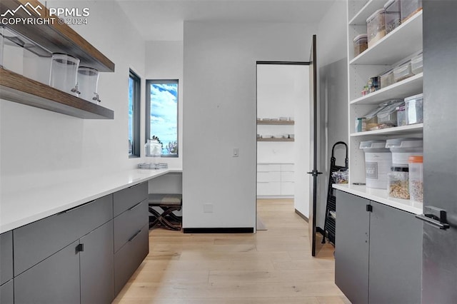 interior space with light hardwood / wood-style floors and built in desk