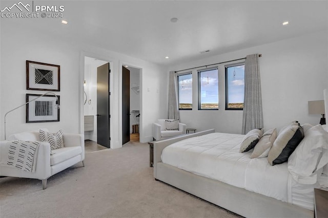 carpeted bedroom featuring a walk in closet, a closet, and connected bathroom