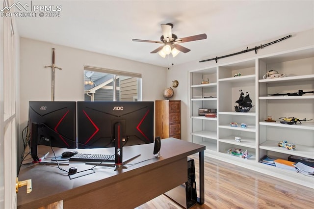 office space with ceiling fan and light hardwood / wood-style flooring