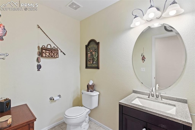 bathroom featuring tile patterned flooring, vanity, and toilet