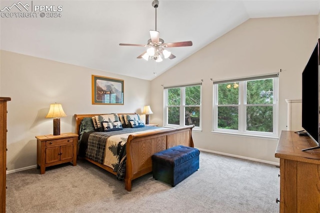 bedroom with ceiling fan, light colored carpet, and multiple windows