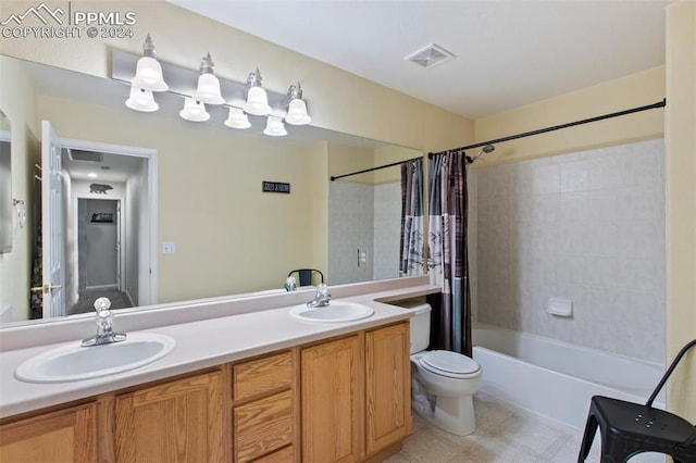 full bathroom featuring vanity, toilet, and shower / bath combo with shower curtain