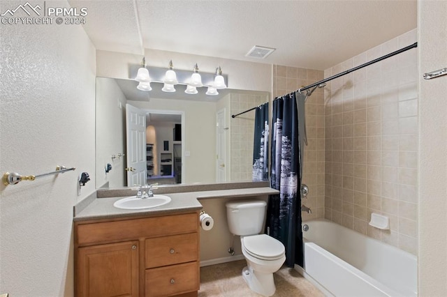 full bathroom featuring shower / bathtub combination with curtain, vanity, a textured ceiling, and toilet