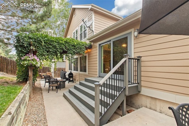 entrance to property featuring a patio