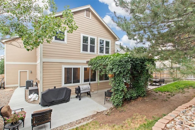 back of property featuring a patio and central air condition unit