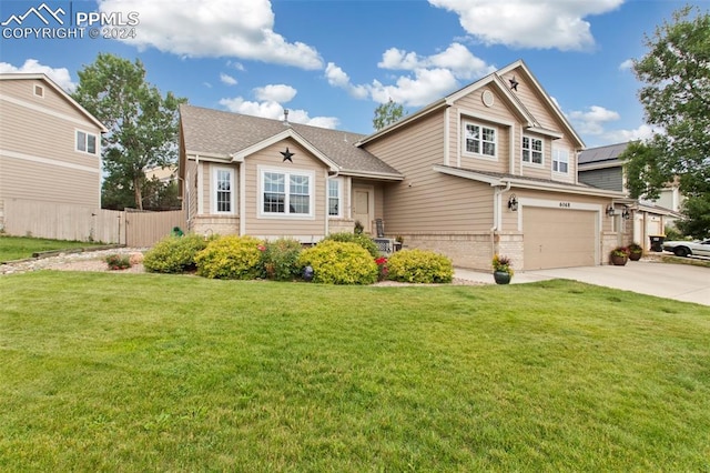 craftsman-style home featuring a garage and a front yard