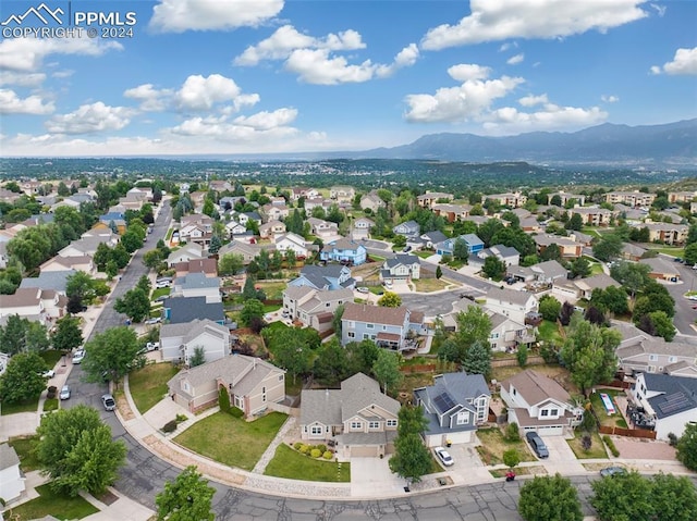 birds eye view of property featuring a mountain view