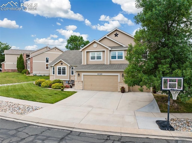 craftsman inspired home featuring a front yard and a garage