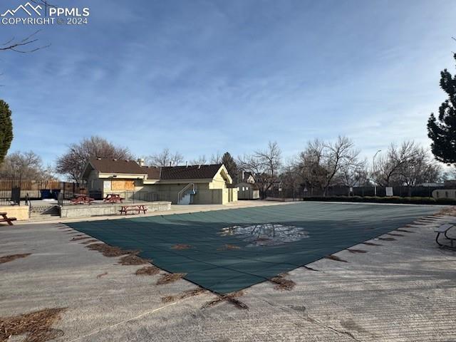 view of swimming pool featuring a patio area