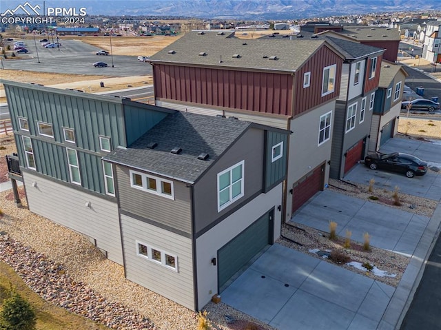 birds eye view of property with a mountain view