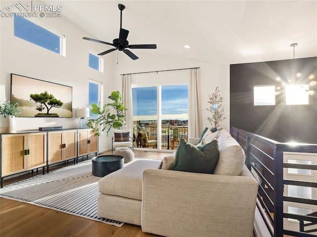 living room featuring hardwood / wood-style flooring, ceiling fan, and lofted ceiling