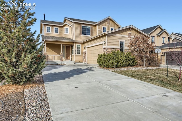 view of front of property with a porch and a garage