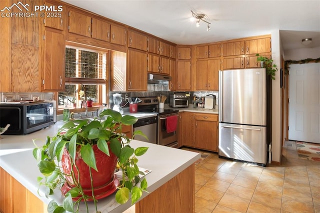 kitchen with stainless steel appliances and light tile patterned floors