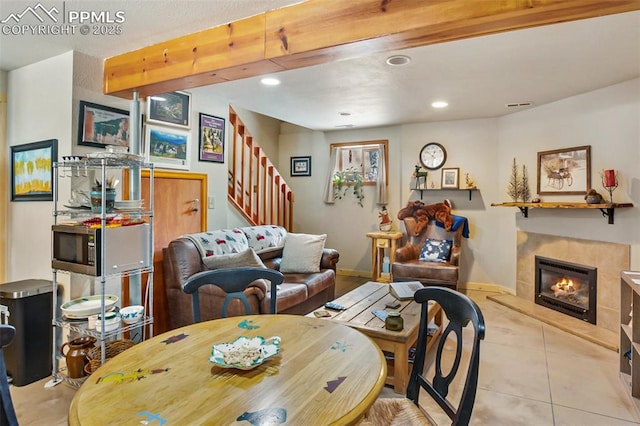 tiled living room featuring beamed ceiling