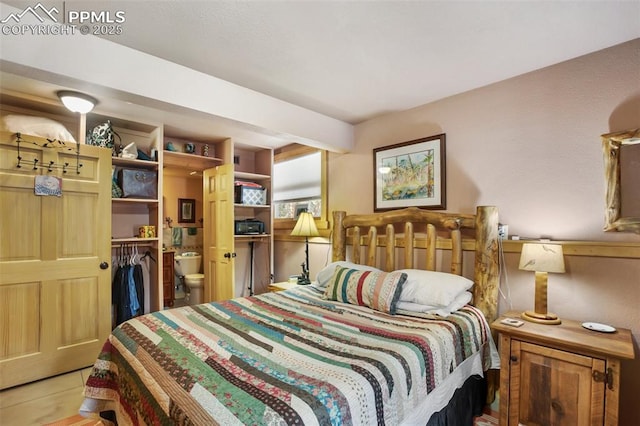 bedroom with connected bathroom