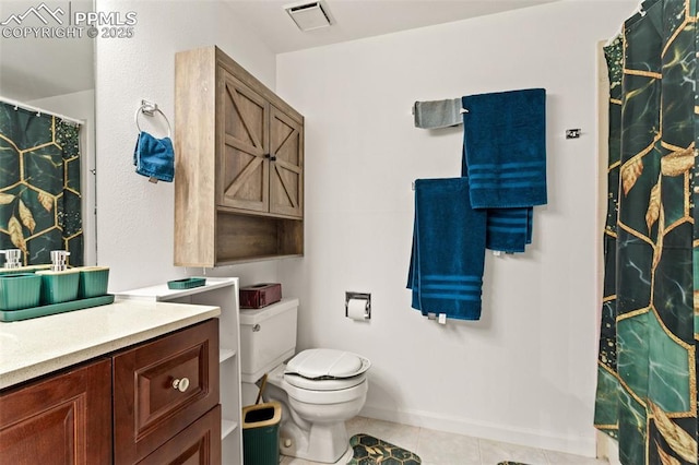 bathroom with toilet, tile patterned flooring, and vanity