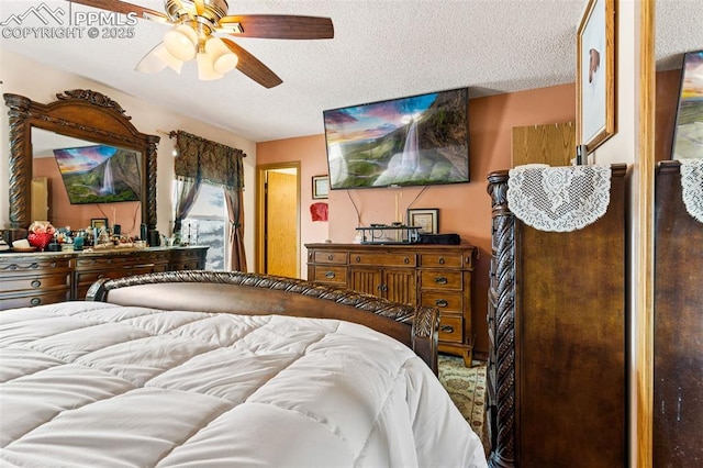 bedroom with a textured ceiling and ceiling fan