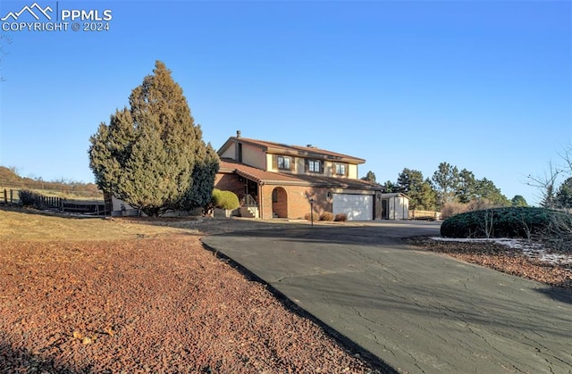 front of property with a garage