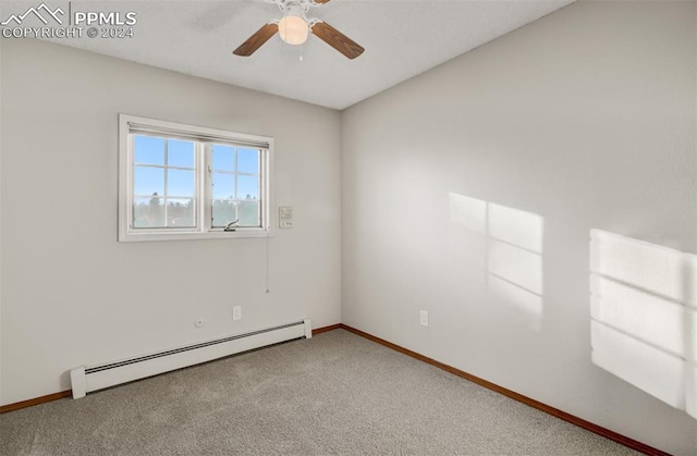 spare room featuring carpet, ceiling fan, and a baseboard radiator