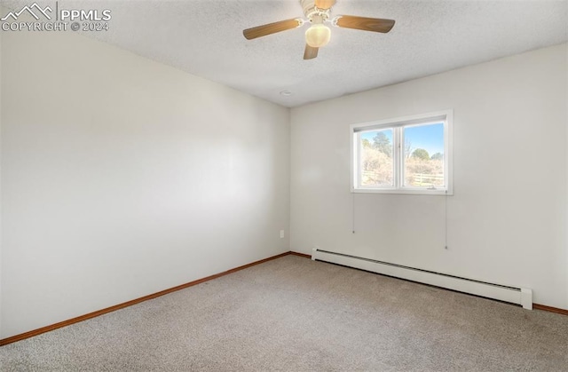 spare room featuring ceiling fan, carpet floors, and a baseboard radiator