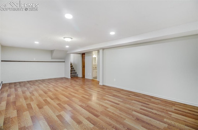 basement featuring light hardwood / wood-style flooring