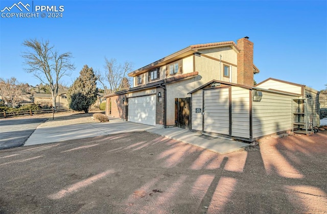 view of property exterior with a garage