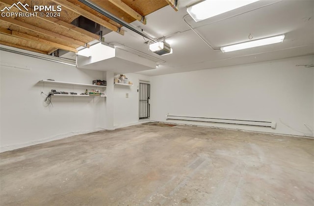 garage featuring a garage door opener and baseboard heating