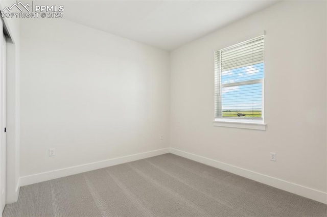 empty room featuring carpet flooring