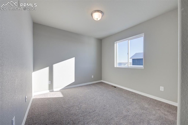 unfurnished room featuring carpet floors